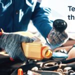 Person in gloves pouring oil into a car engine with the text "Tend to the Basics" displayed on the right side.